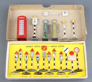 Dinky, a set of 12 Road signs (No.47) boxed, together with a Dinky red telephone box (12c), a Three face traffic light (47b), a pair of Belisha beacons (47d)  and two Timpo petrol pumps 
