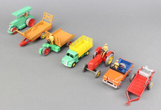 Dinky farming models consisting of  a Massey-Harris tractor (27a) with red body and yellow cast wheels, a disc harrow (27h), a moto cart (27g), a Farm Produce Wagon (30n) with Green cab yellow back and hook, an Aveling Barford Road Roller (25p) in pale/mid green with hook and a Land Rover (27) in orange with blue interior