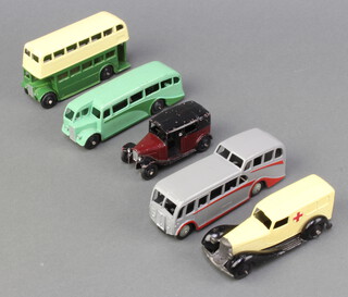 Dinky, a 1947 Double Decker Bus (29c) with Cream top and Green Lower Deck AEC/STL grille with no advertisements and black ridges hubs, a Single Deck Bus (29e) in light green with dark green flashes and black hubs, a 1948/50 Taxi with driver (36g) in maroon with black roof the chassis moulded and open rear window, an Observation coach (29f) in grey and a 1947-48 Ambulance (30f) in cream and black with moulded chassis.
