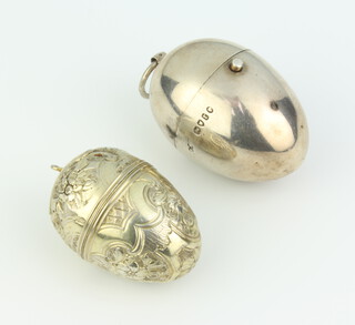 A Victorian silver egg shaped cotton reel holder London 1872, together with a repousse silver egg shaped box 52 grams 
