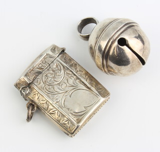 An Edwardian octagonal chased silver vesta, Chester 1908 and a silver bell Birmingham 1931 