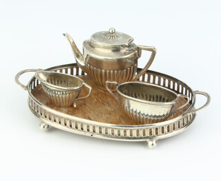 An Edwardian miniature silver 3 piece demi-fluted tea set and tray, Birmingham 1905