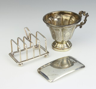 A silver card case Birmingham 1925, a toast rack and cup, 148 grams