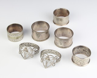 A pair of silver napkin rings Birmingham 1926, 2 others and 2 plated ditto, 82 grams 