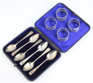 A set of 4 silver napkin rings Birmingham 1931, a matched set of 6 silver Georgian teaspoons 138 grams 