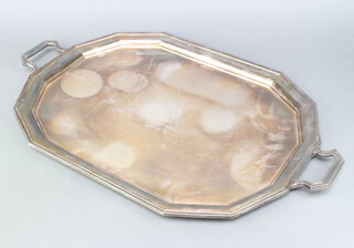 An octagonal silver plated 2 handled tray 65cm