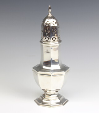 An octagonal silver shaker of plain form Birmingham 1927, 21cm, 176 grams