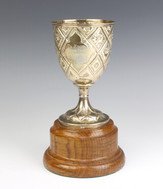 A Victorian repousse silver presentation goblet with inscription and floral motifs 16cm, 250 grams, maker George Angell? 
