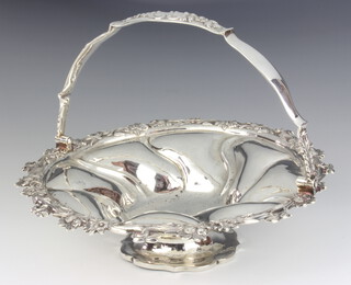 A George III silver swing handle basket with floral rim, London 1736, 496 grams, 25cm 