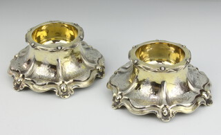 A pair of Victorian cast silver table salts with scroll decoration, London 1847, maker Charles Thomas Fox and George Fox, 12.5 cm, 346 grams