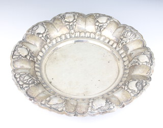 A Continental repousse silver bowl decorated with flowers and fruits 36cm, 968 grams 