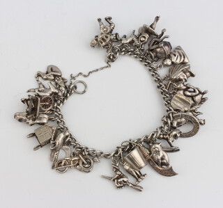 A silver charm bracelet 98 grams