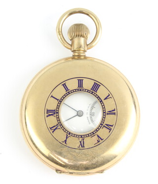 A gentleman's gold plated half hunter pocket watch with seconds at 6 o'clock, the face inscribed Elgin 
