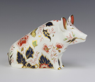 A Royal Crown Derby Imari pattern paperweight of a sitting pig with gold stopper 11cm 