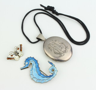 A silver and guilloche enamelled seahorse brooch by David Andersen together with a butterfly brooch and an oval locket 