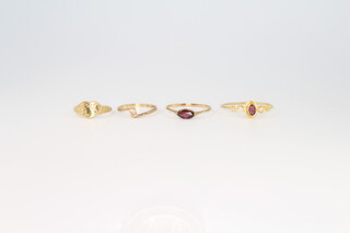 Four 9ct yellow gold gem set rings, size F, I, P and X, 4 grams