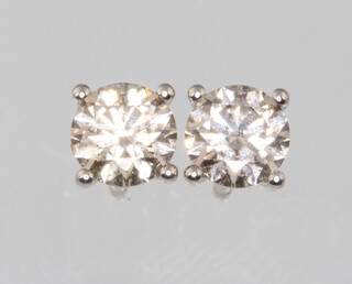 A pair of 18ct white gold single stone diamond ear studs approx. 1.01ct