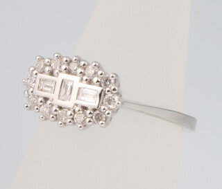 An 18ct white gold Edwardian style diamond ring, 0.5ct, size O 