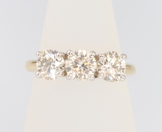 An 18ct yellow gold 3 stone diamond ring, approx. 2.14ct, size M