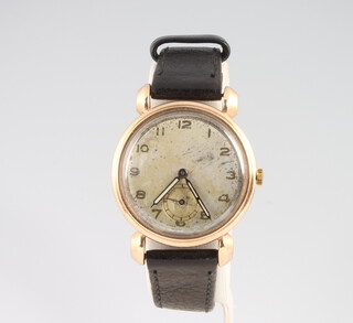 A gentleman's 9ct yellow gold Trebex wristwatch with 36 mm case, on a leather strap 