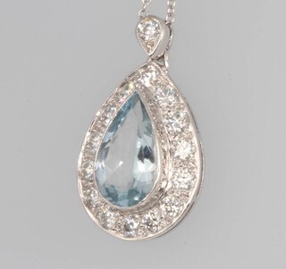 A white gold pear shaped aquamarine and diamond pendant, the centre stone approx. 2ct surrounded by brilliant cut diamonds 0.9ct 25mm on a 40cm chain