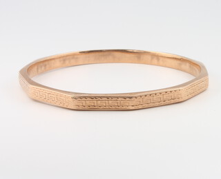 A 9ct yellow gold engine turned bangle, 10.5 grams 