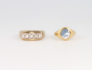 A 9ct yellow gold paste set ring, size T and an 18ct yellow gold hardstone ring size H 1/2