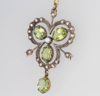 An Edwardian style peridot, seed pearl and diamond pendant on a 9ct chain 