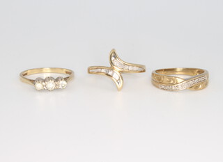 Three 9ct yellow gold diamond rings size N 