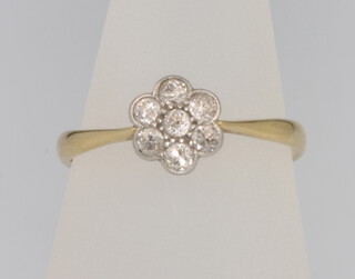 An 18ct yellow gold diamond cluster ring size M 1/2 