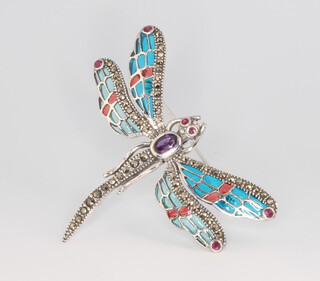 A silver marcasite, enamelled and amethyst dragonfly brooch