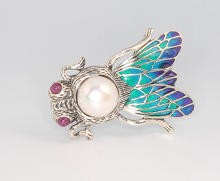 A silver ruby and enamelled pearl bug brooch 