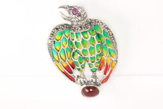A silver eagle brooch with enamelled marcasite and cabochon ruby decoration 