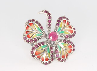 A silver ruby and enamelled 4 leaf clover brooch 