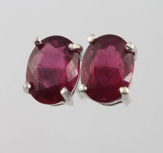 A pair of treated ruby ear studs