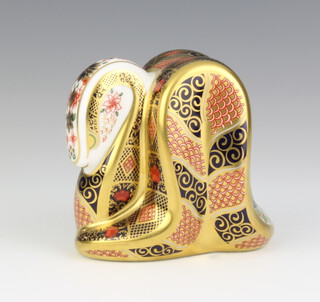 A Royal Crown Derby Imari pattern paperweight of a snake with gold stopper, 8cm 