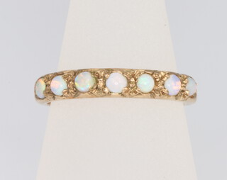 A 9ct yellow gold 7 stone opal ring, size O, 2.4 grams