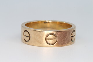 A gentleman's 9ct yellow gold Cartier style ring, size T, 8.7 grams