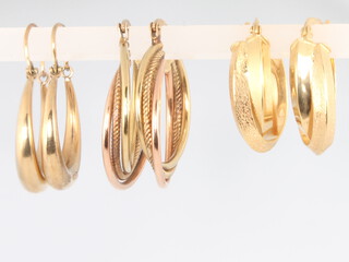 Three pairs of 9ct yellow gold hoop earrings, 6 grams