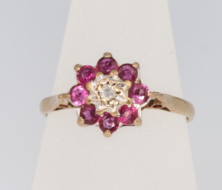 A 9ct yellow gold ruby and diamond cluster ring size M 1.9 grams