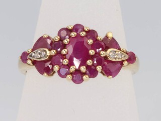 A 9ct yellow gold ruby and diamond cluster ring, size O, 2.7 grams 