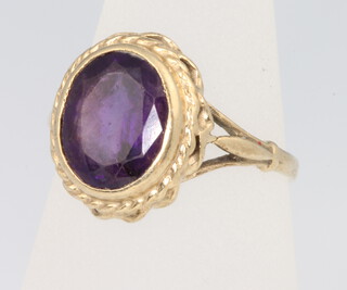 A 9ct yellow gold oval amethyst ring, size L, 3.2 grams