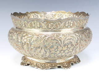 An Indian repousse silver flared rim baluster bowl decorated with formal flowers, 26cm, 1136 grams 