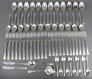 A canteen of Art Deco silver cutlery comprising 11 tea spoons, 12 dessert spoons, 12 table spoons, 2 ladles, 12 dessert forks, 12 dinner forks, 2 butter knives, London 1933, 3070 grams 