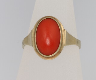 An  8ct coral ring size N, 2.3 grams