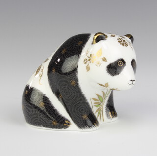 A Royal Crown Derby Imari pattern paperweight of a baby panda with gold stopper 7cm