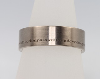 A gentleman's 18ct white gold wedding band engraved Love, Devotion, Passion, size T 1/2, 12.9 grams 