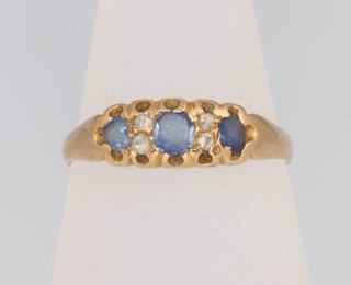 An 18ct yellow gold sapphire and diamond ring, size L, 2 grams