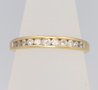 An 18ct yellow gold channel set diamond ring approx. 0.25ct, size M, 2 grams