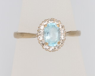 A 9ct yellow gold aquamarine and diamond cluster ring size R, 2.1 grams